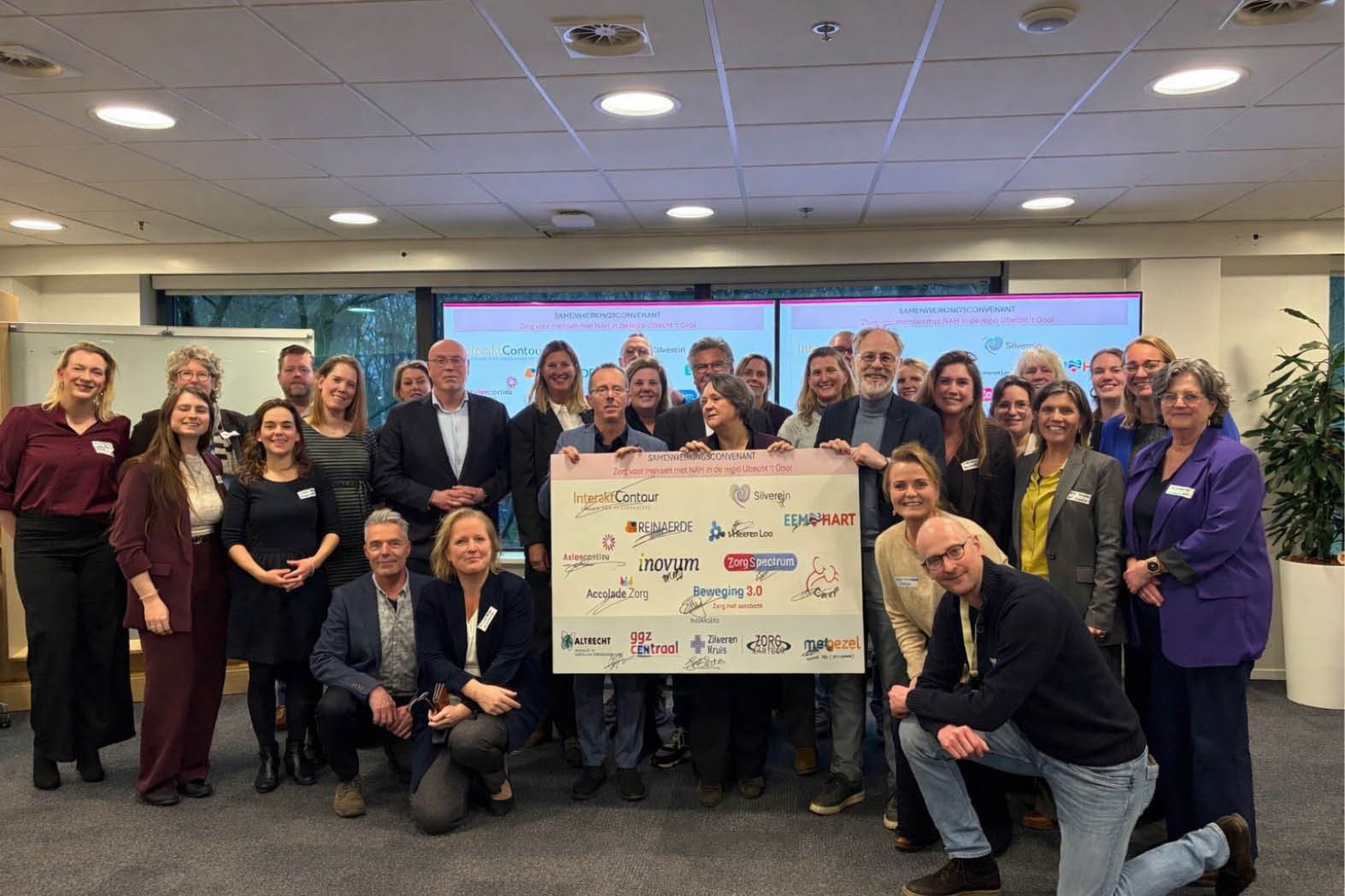 A group of people are posing for a picture in front of a large check. AI generated content